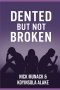 DENTED BUT NOT BROKEN